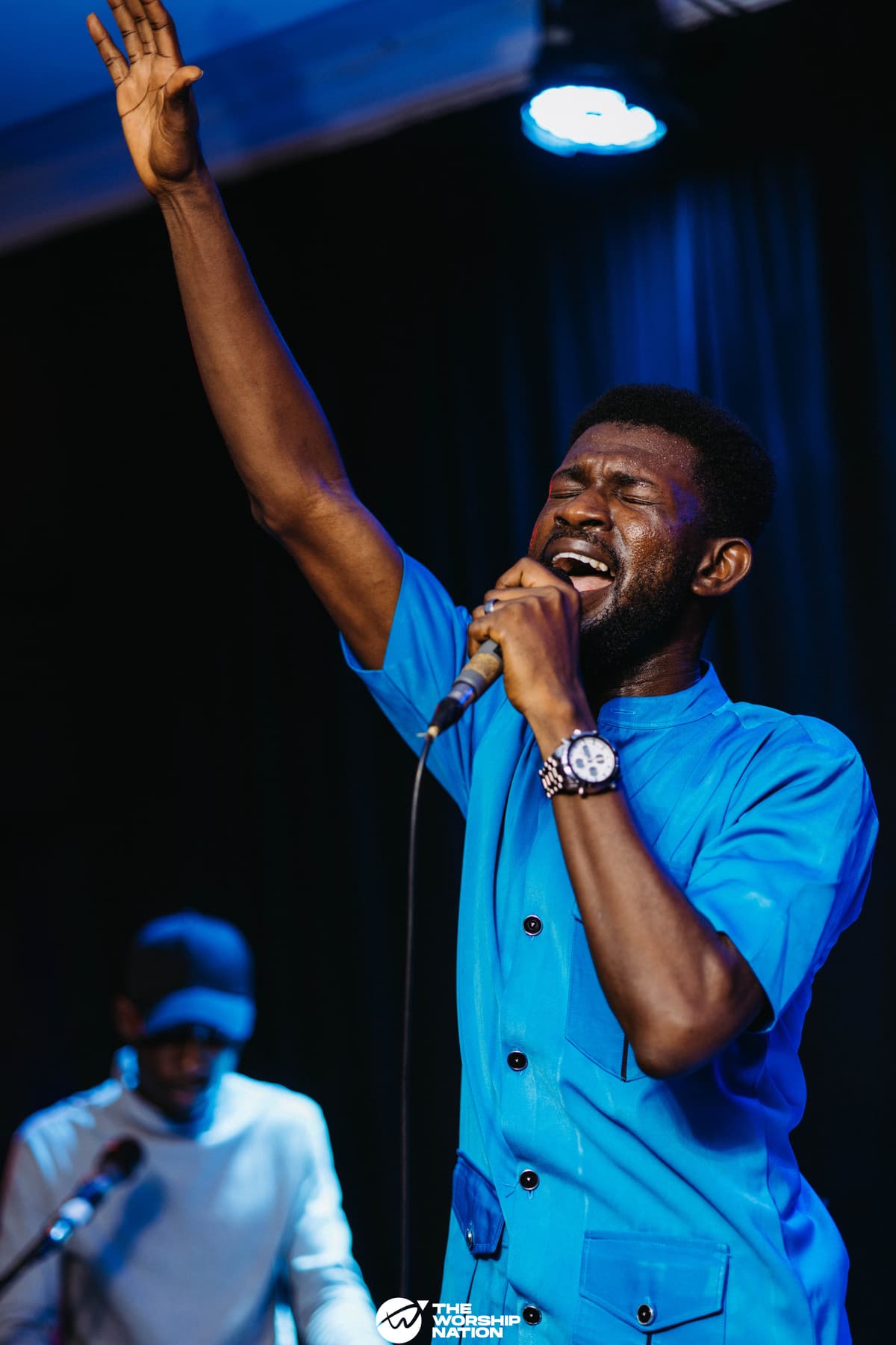 Solomon Stephen — hands raised in worship